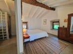 Bed with wooden beam Bed with wooden beam